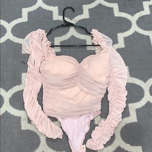 I’m selling a peach fashion nova body suit!